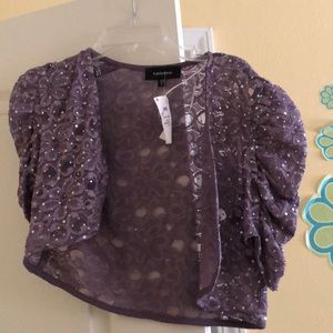 A purple cover up with mini silver sequins